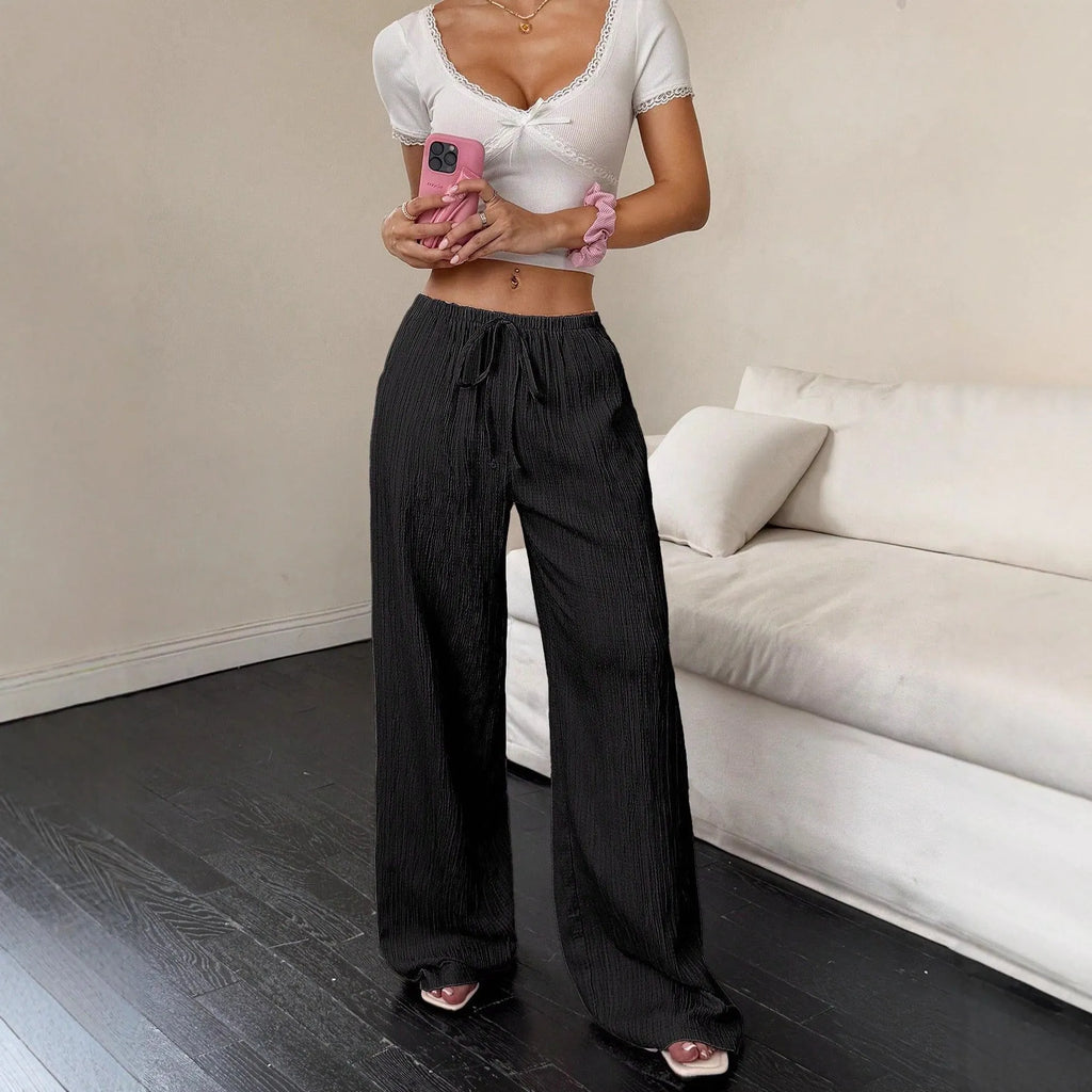 Black wide leg women's trousers with a lace-up detail on the mid waist