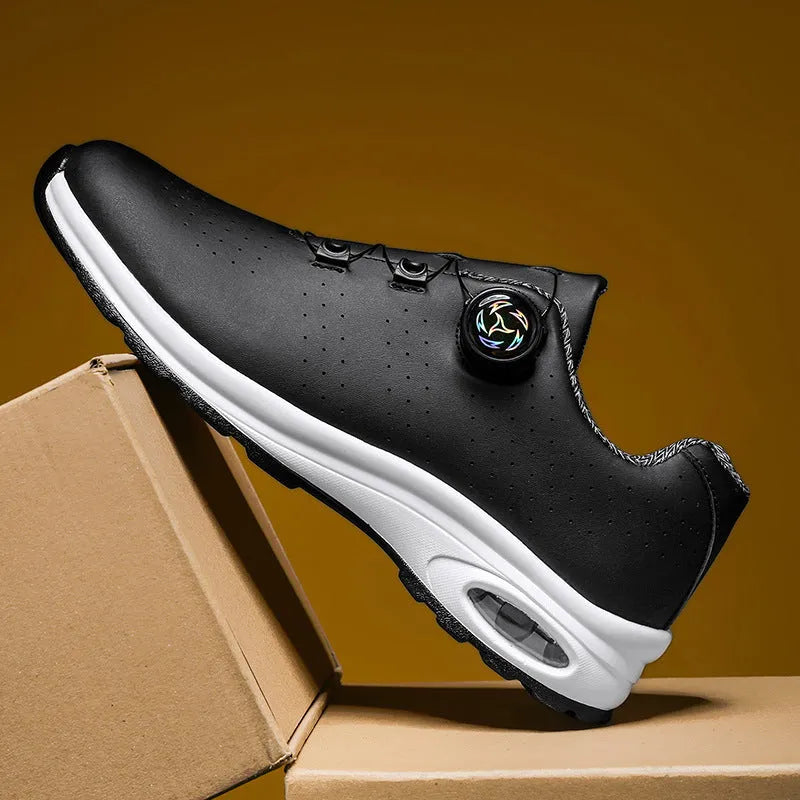 Men's black and white low-top mesh casual tennis shoes with lace-up front and cross straps.