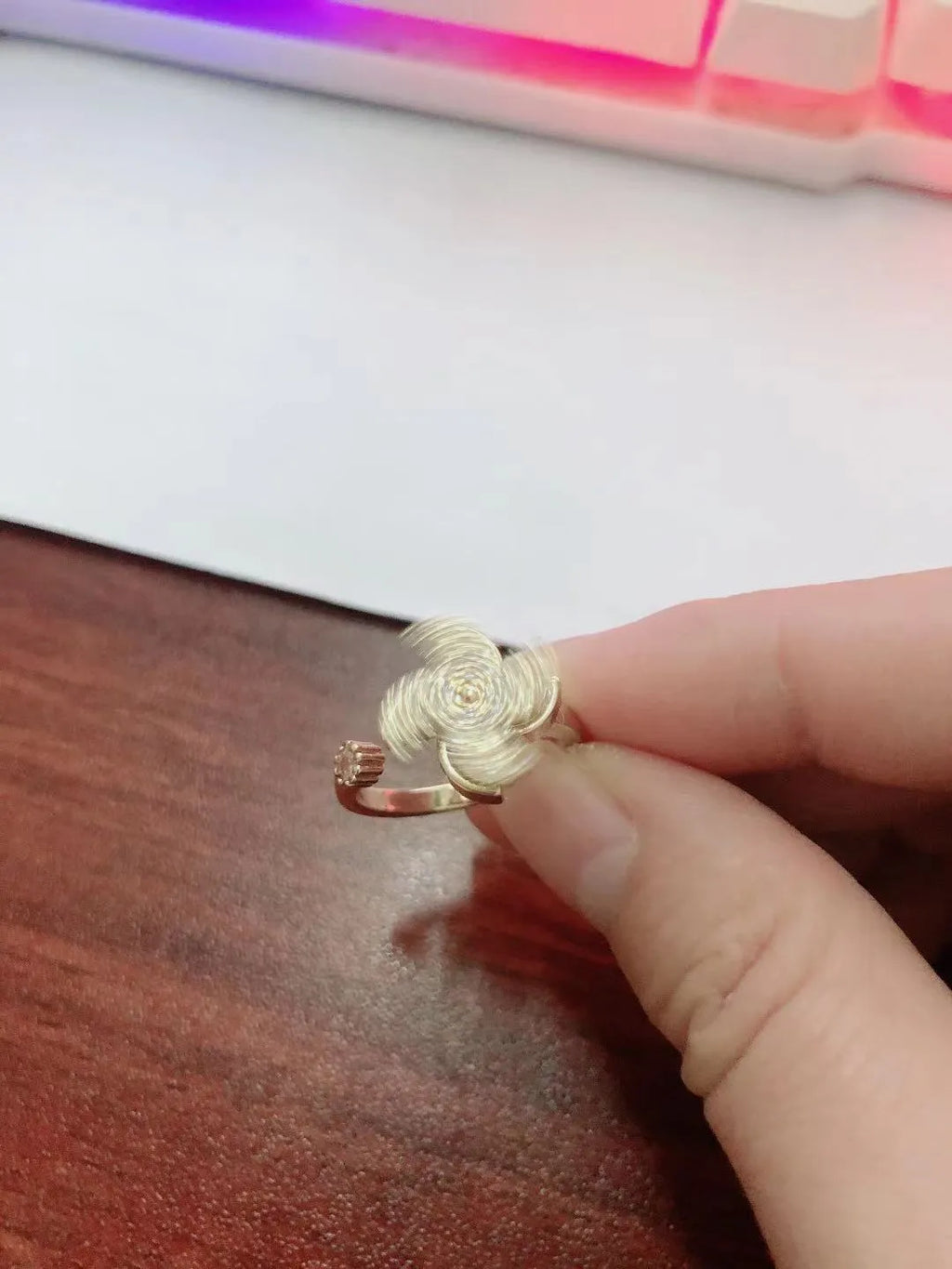 Geometric copper spinner ring with rotating windmill design in gold or silver electroplated finish