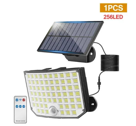 White solar-powered outdoor garden lamp with motion sensor on a black stake.