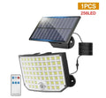 White solar-powered outdoor garden lamp with motion sensor on a black stake.