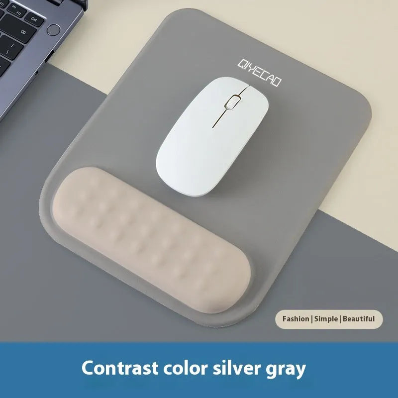 Ergonomic mouse pad with raised wrist support in a choice of contrast colour patterns on a desk.