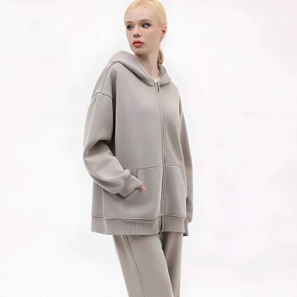 Woman's loose-fit fleece-lined cardigan sweater with a hood in a distressed colour, showing patch pockets and drop-shoulder sleeves.