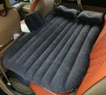 Inflatable car bed with flocked surface and two pillows, shown inside a five-seater vehicle.