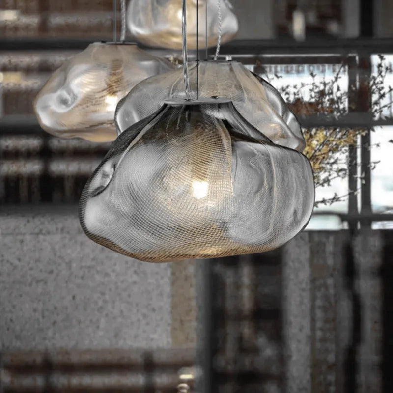 Postmodern glass decorative chandelier with a fabric design, shown in clear and smoke grey light options.