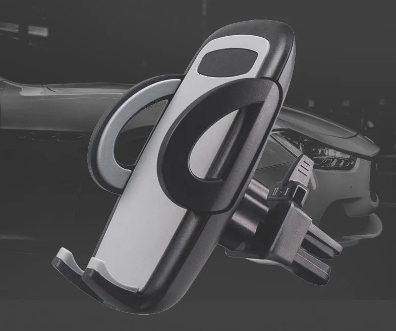 Black plastic mobile phone holder mounted on car air conditioning outlet vent