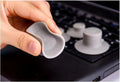 Set of four grey plastic laptop cooling pads, two large and two small, on a desk.