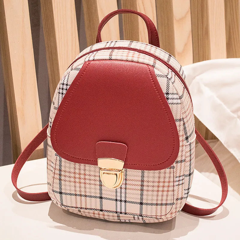 A one shoulder diagonal phone bag made of smooth PU fabric, shown in one of five available colours.