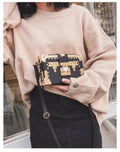 Hard structured PU leather women's shoulder bag with rivet decoration and hasp closure flap
