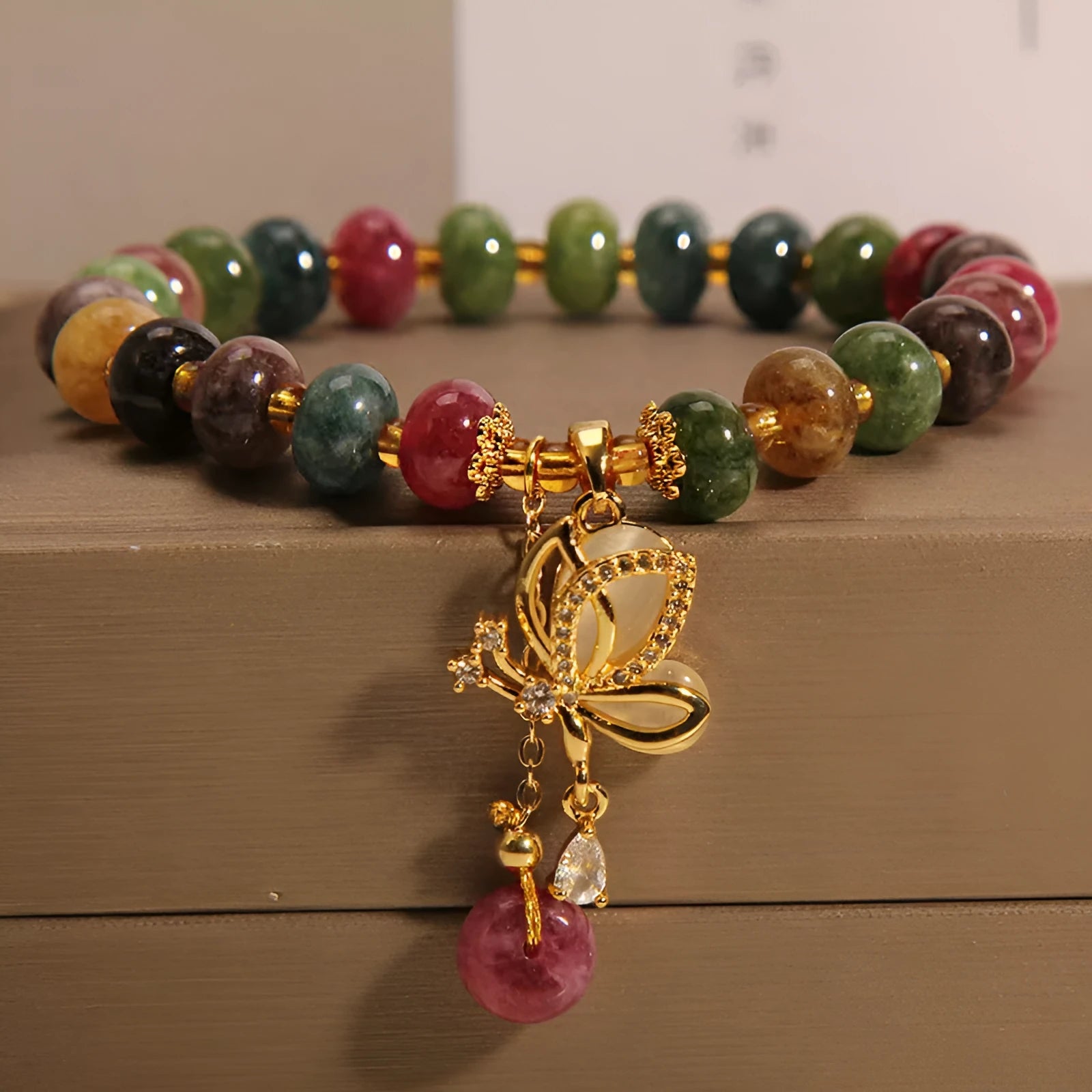 Colourful women's butterfly bracelet with tourmaline beads on alloy construction