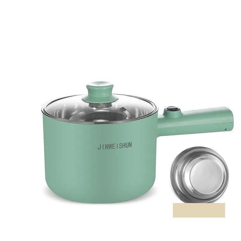Compact white electric multi-function hot pot with non-stick interior on a kitchen countertop