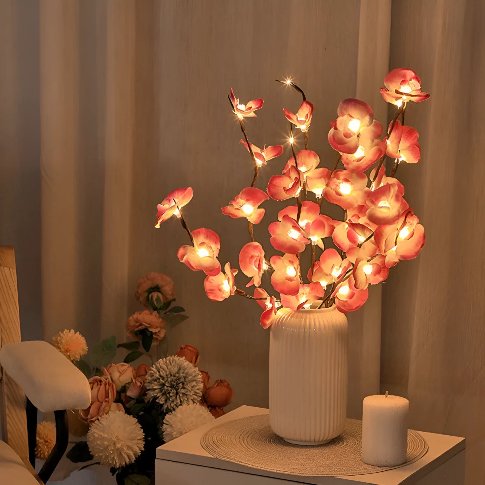 Pink LED phalaenopsis orchid branch decorative light on a table