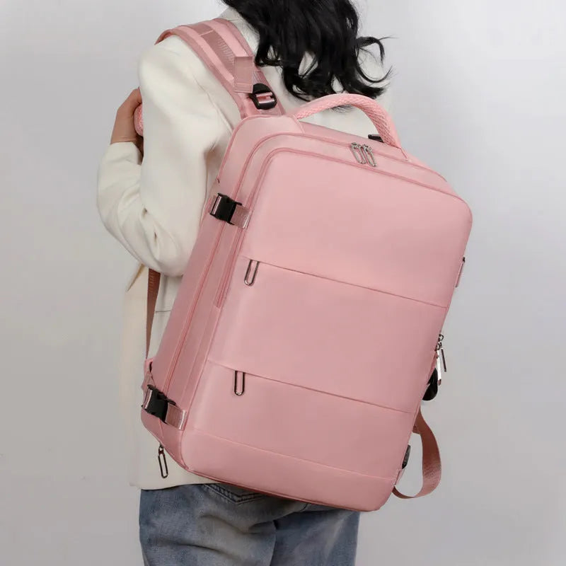 Large purple travel backpack with multiple compartments and an air pillow belt, shown open to display interior organisation.