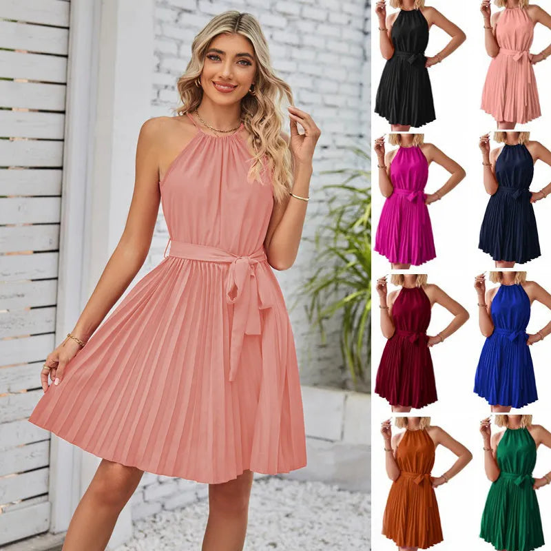 Women's black halter neck chiffon sundress with a pleated midi skirt and waist tie.