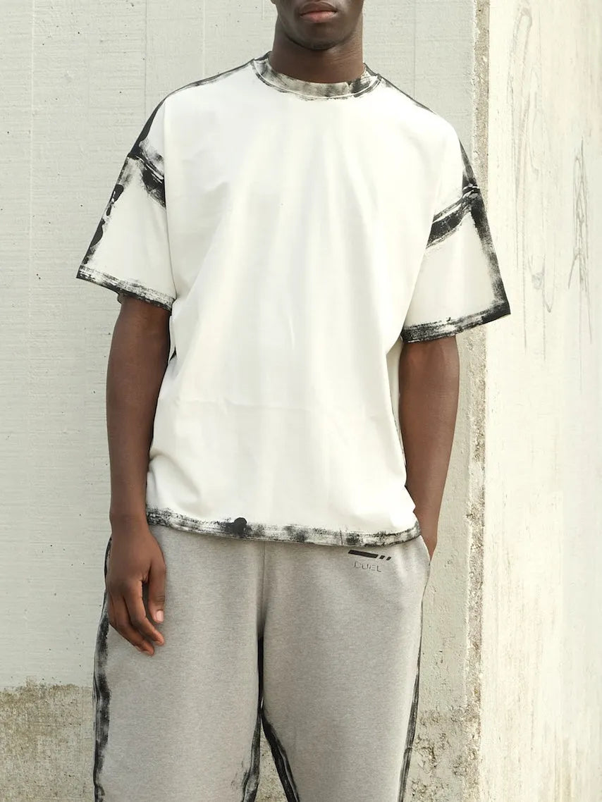 White short sleeve casual top with draped design and printed detail on polyester fabric
