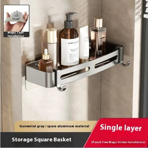 Gun grey metal triangle corner shelf mounted on a bathroom wall for shower storage.