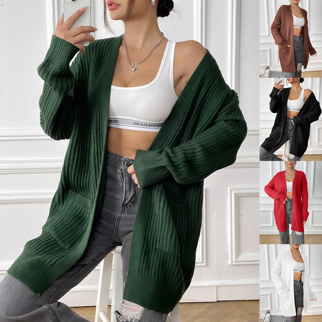 Women's dark green double pocket cardigan sweater with a V-neck and long sleeves laid flat.