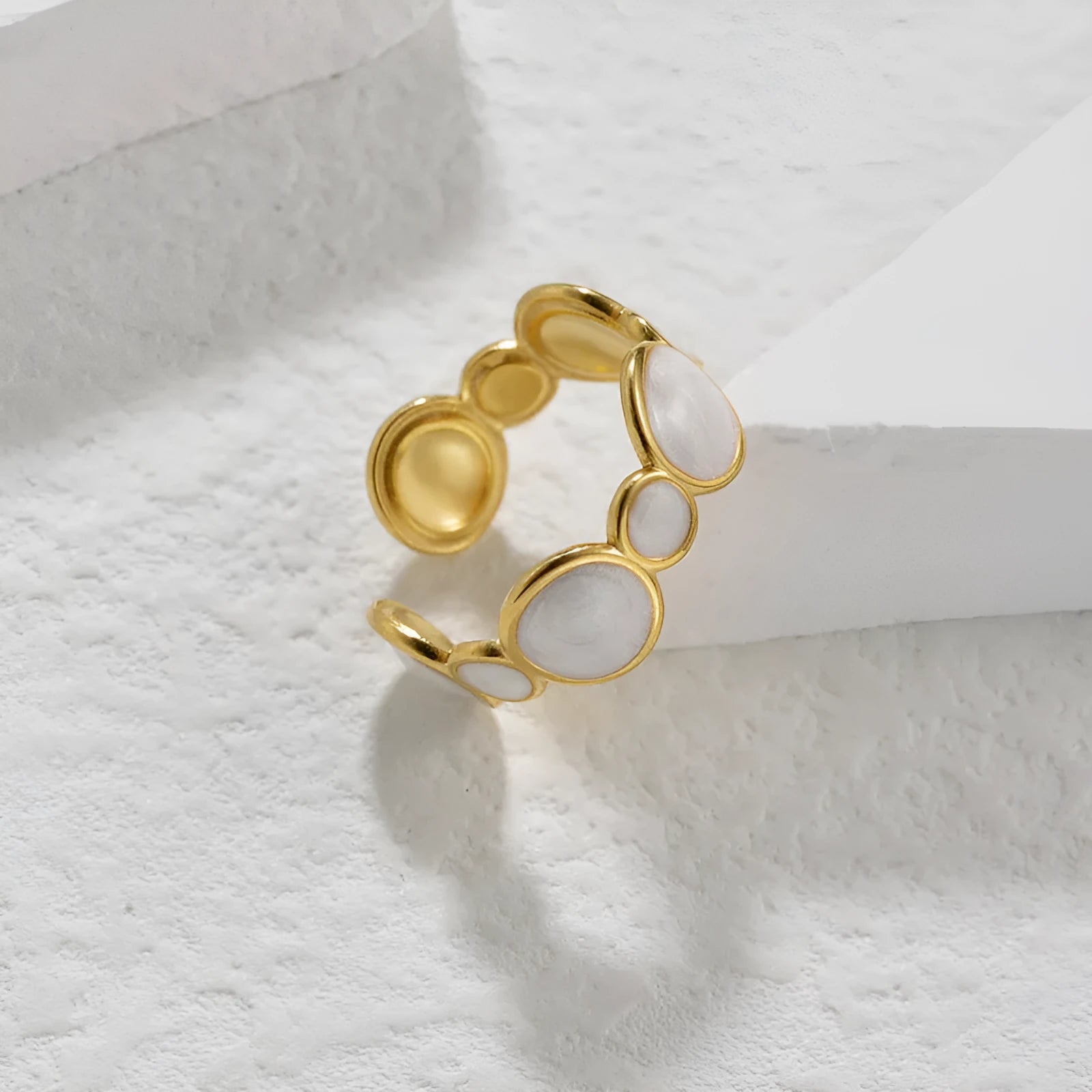 Adjustable geometric stainless steel ring with an electroplated finish for women.