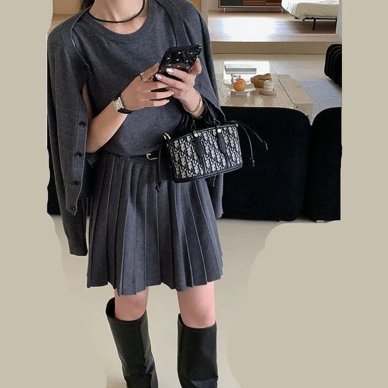 Women's grey art retro knitted cardigan and pleated vest skirt two-piece set.