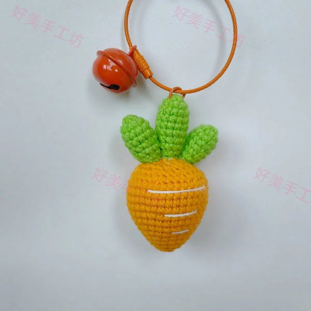 Soft wool cartoon carrot shaped keychain pendant on a keyring.