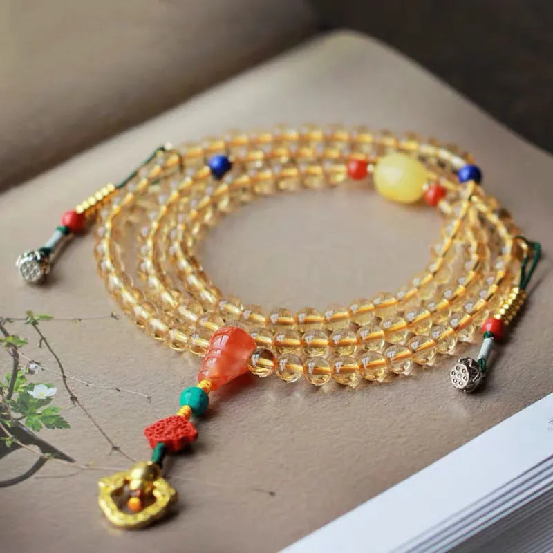 Natural Brazilian citrine bracelet with small 1mm red and yellow beads and filament accessories.