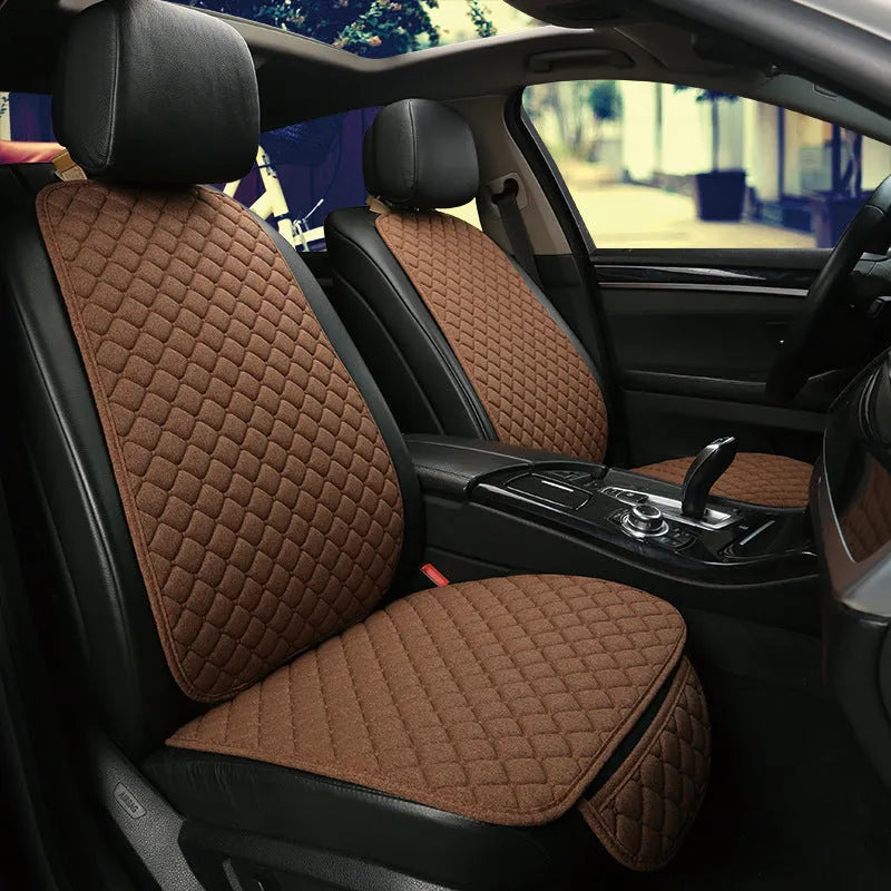 Linen car seat cushion with removable elastic straps shown in multiple colour options including warm cream, coffee, and Lafite red