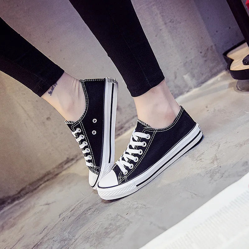 Women's solid colour canvas casual shoes shown in black, white black, white red, and all black.
