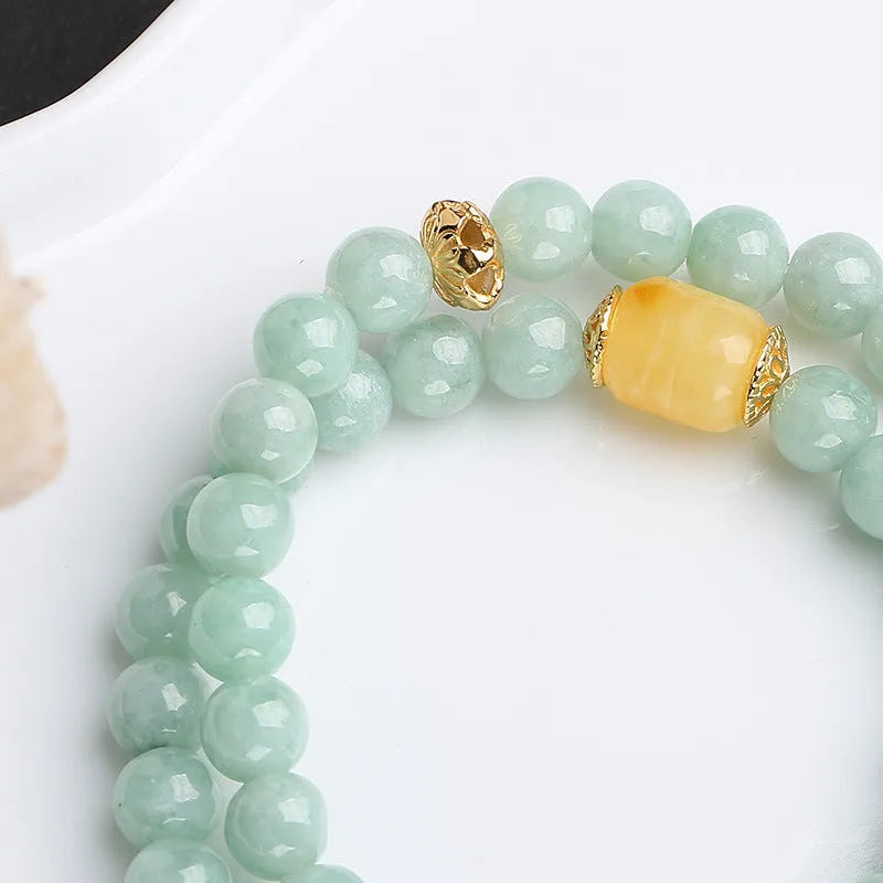 Double-layer women's bracelet with jade round beads and beeswax barrel beads in geometric hanging design