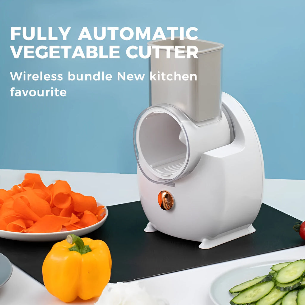 White electric vegetable slicer with suction base and multiple blade options on kitchen counter