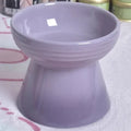 Black chin ceramic pet bowl with high foot and anti-tumble base for dogs and cats.