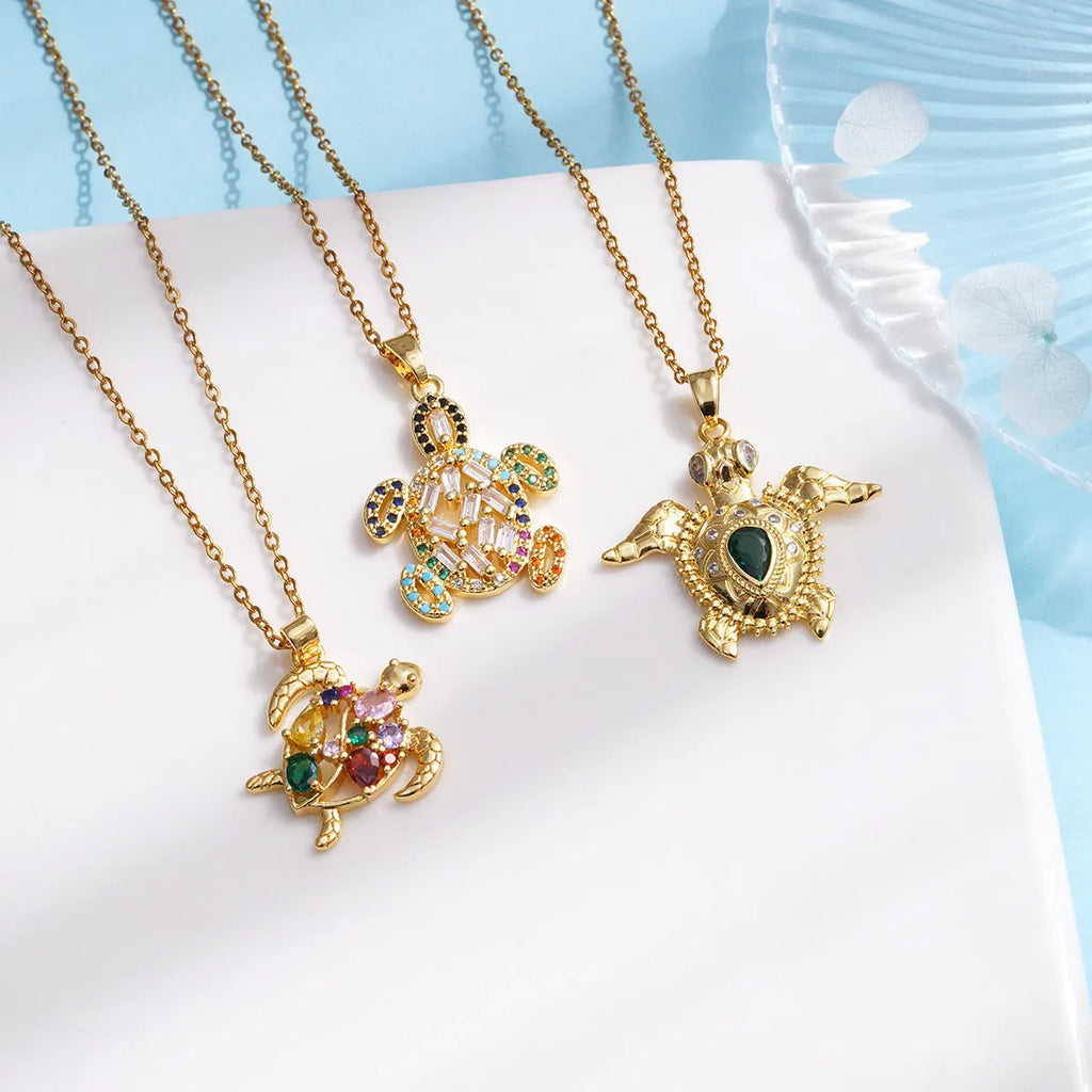 Gold-plated copper sea turtle pendant necklace with mixed gemstone inlay and zirconium encrustation on titanium steel chain