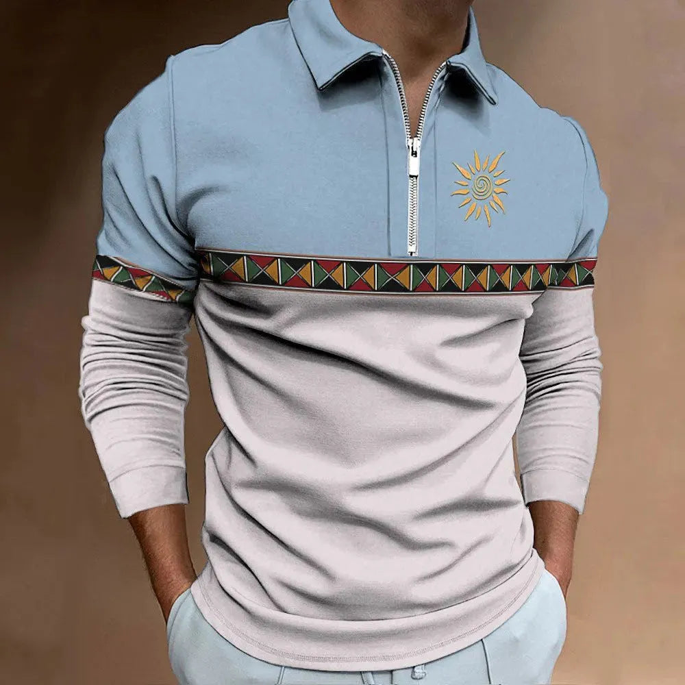 Man wearing a loose-fit, long-sleeve t-shirt with retro striped colour printing and a decorative zip detail.