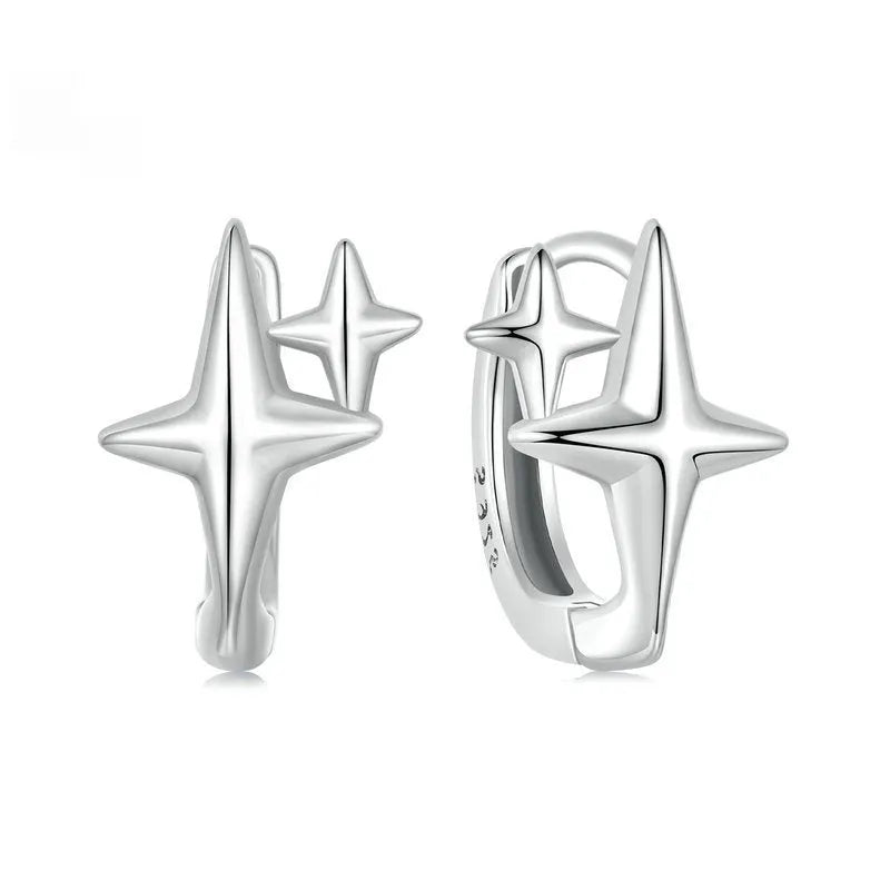 Minimalist silver star clip-on earrings with XINGX detail for women.