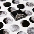 Black decorative stickers showing moon phases, calendar planets and hand account designs