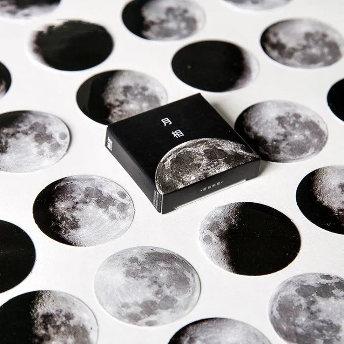 Black decorative stickers showing moon phases, calendar planets and hand account designs
