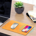 Brown leather wireless charging mouse pad with Micro USB cable for fast 5V Qi charging.