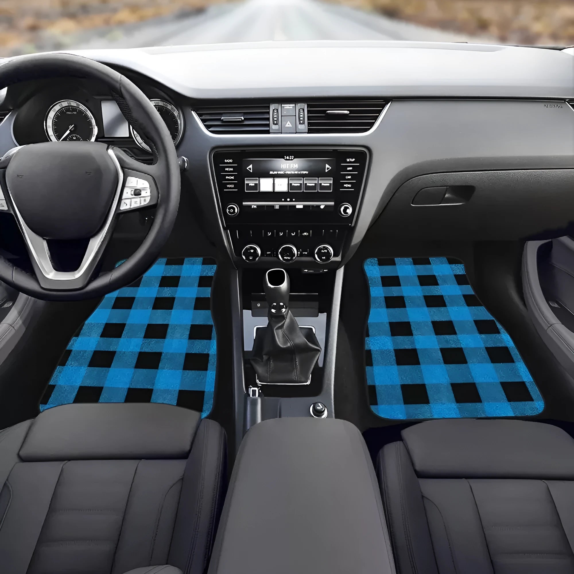 Black printed rubber car foot mat set showing textured surface and raised edges.