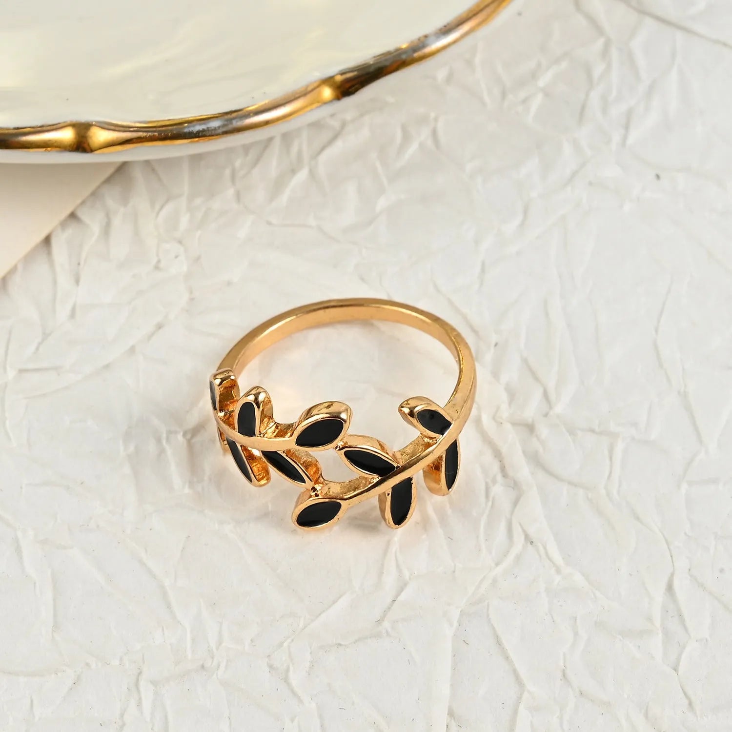Gold electroplated geometric leaf ring with floral elements for women's index finger