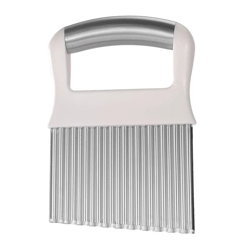 Stainless steel potato wave knife with corrugated blade on a kitchen counter.