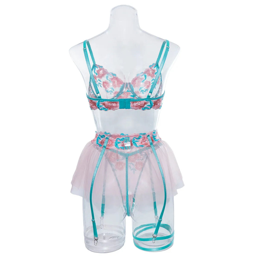 Pink women's mesh pettiskirt costume suit with matching bikini on a mannequin.
