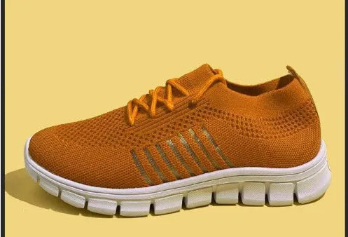 Women's breathable high-cut lace-up casual sneaker on a flat platform heel with a rubber sole.