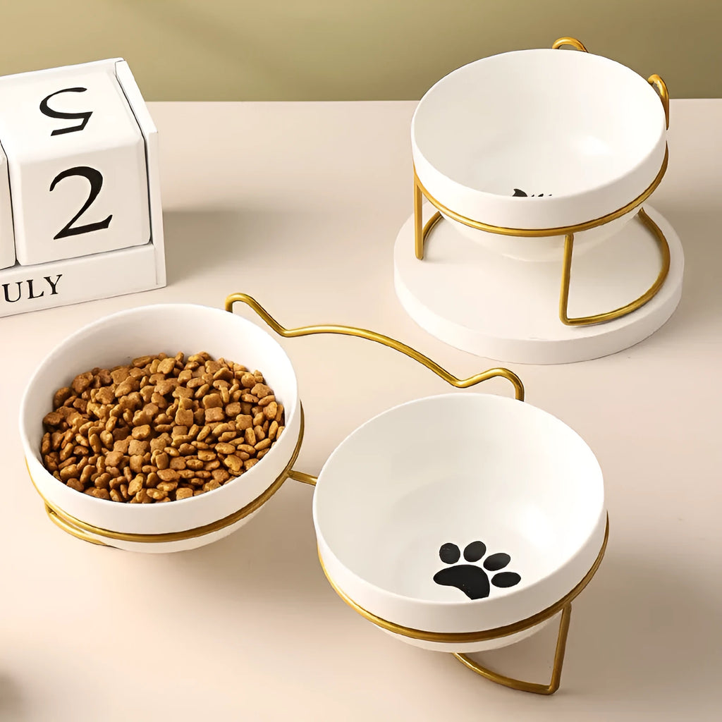 White ceramic cat bowl with cat paw pattern and black iron frame with cat ears