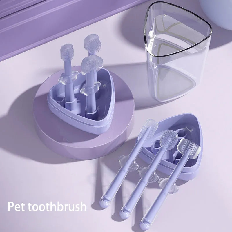 Silicone pet toothbrush for dogs and cats in blue, green, and purple colours on a white background.