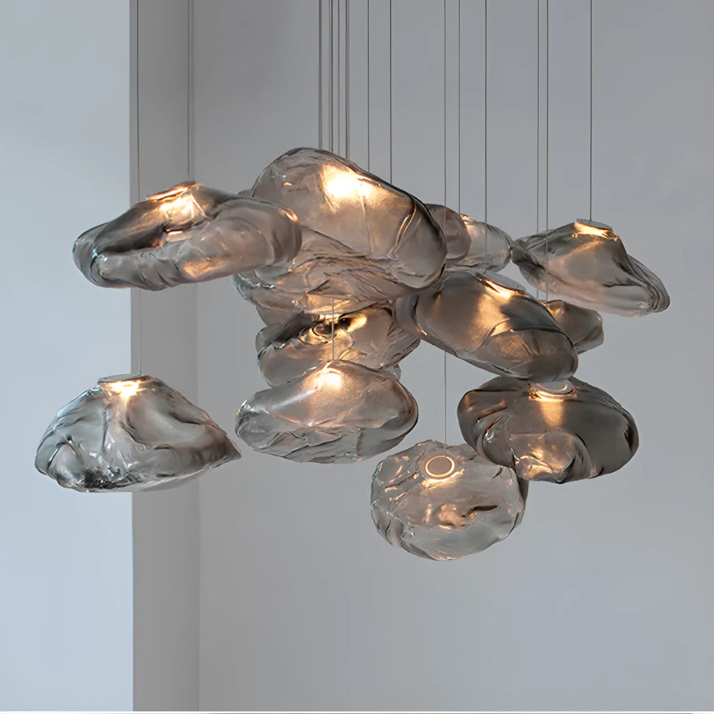 Postmodern glass decorative chandelier with a fabric design, shown in clear and smoke grey light options.