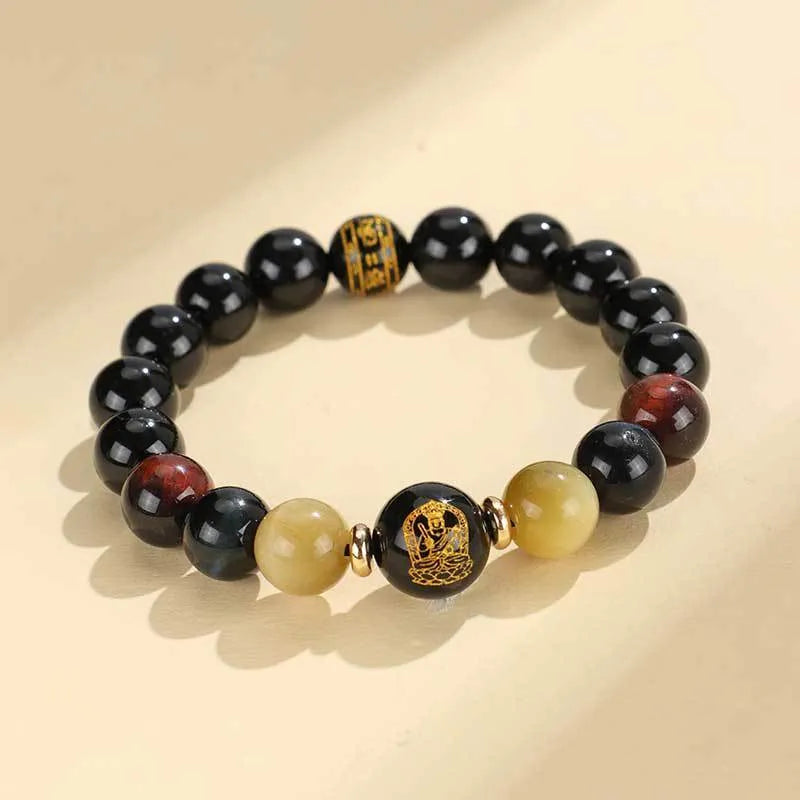 Manually crafted black agate beaded bracelet with gold, blue, and red tiger eye stones, showing ethnic zodiac design.