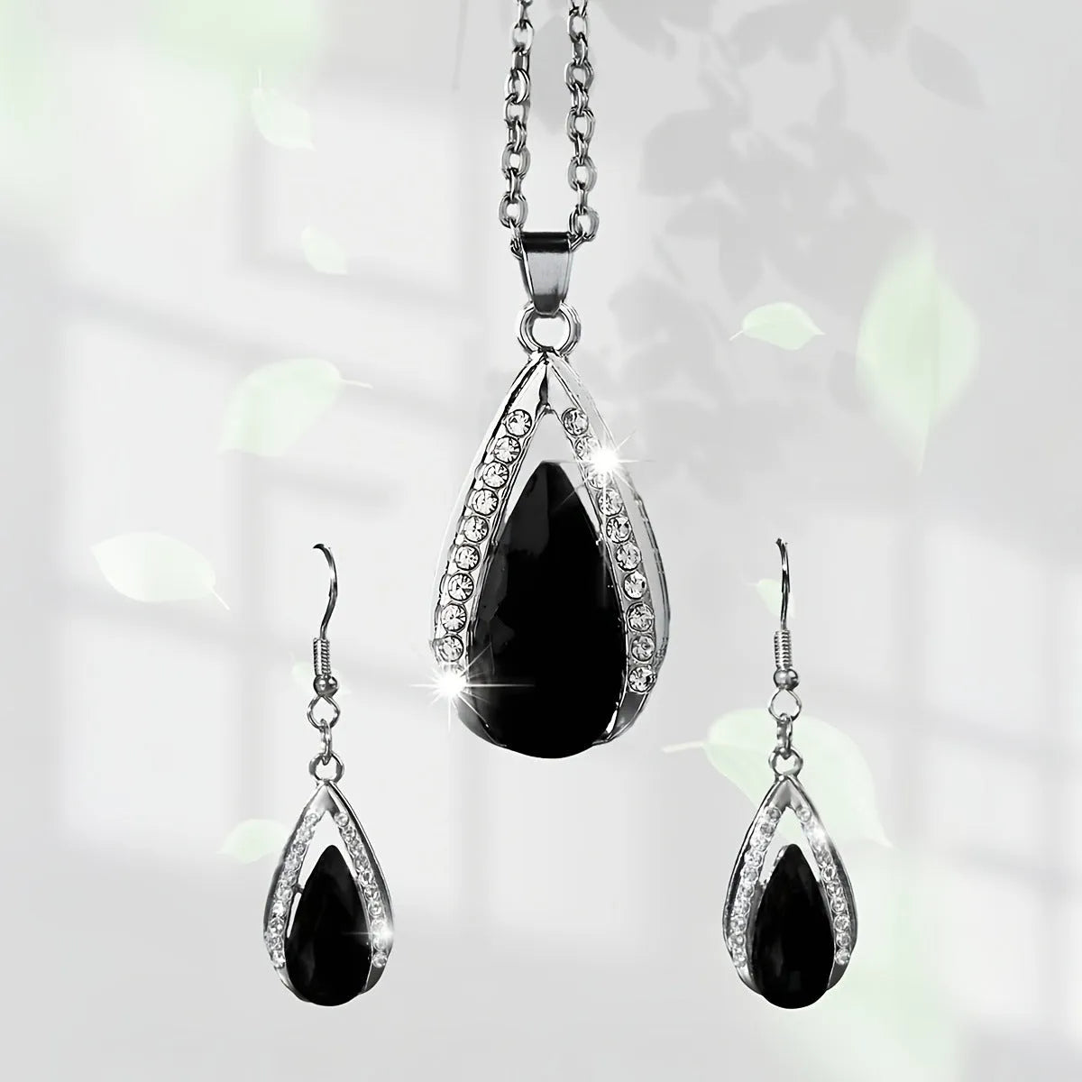 Black and red teardrop pendant necklace and matching alloy earrings set.