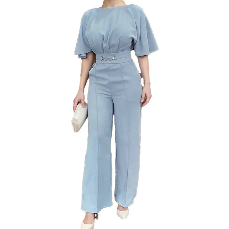 Men's blue two-piece casual suit with long-sleeved jacket and trousers on a hanger.