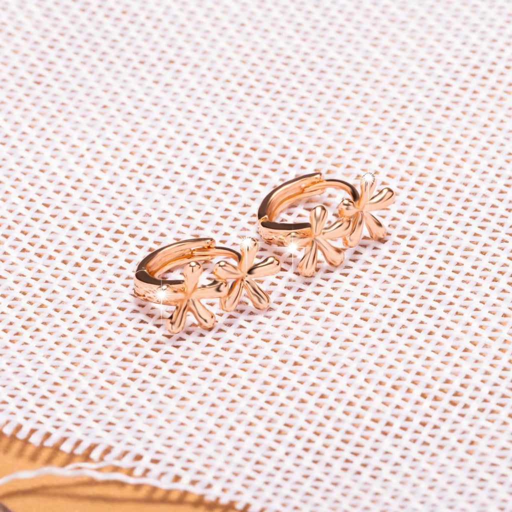 Circular rose gold earrings with a detailed waterdrop flower design for women.