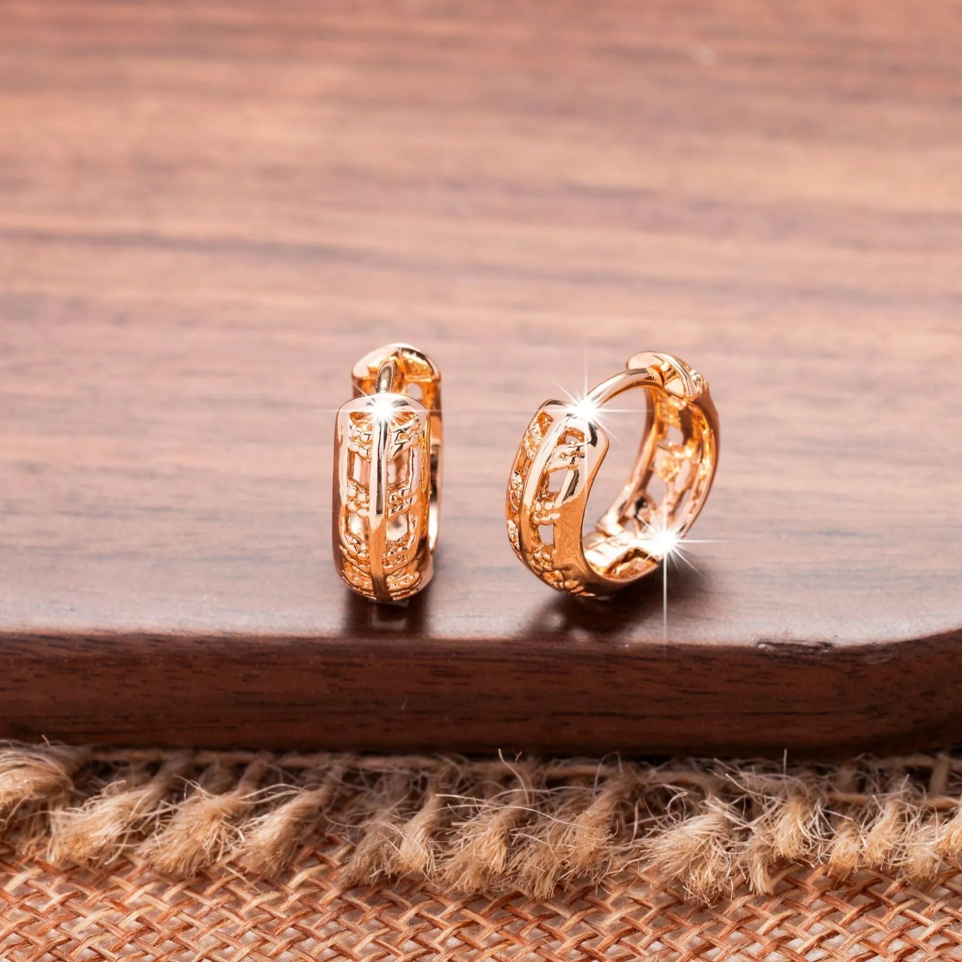 Rose gold plated copper stud earrings with hollowed leaf and heart design.