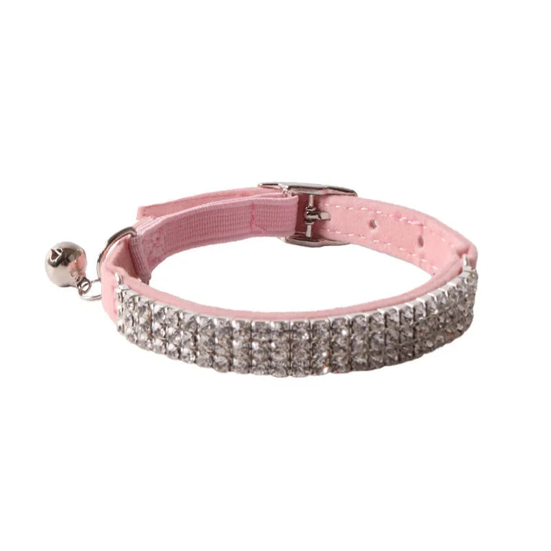 Soft flocked cat collar with elastic buckle in various colours on a white background.